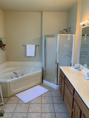 Master bath with jacuzzi tub and separate shower. Double sinks.
