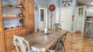 Dining area on your left as walk in door; large table for mealtimes together. 