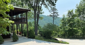Breathtaking views and a peaceful wraparound porch welcome you to the mountains.