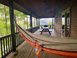 Enjoy meals, naps, or card games on the hammock porch!