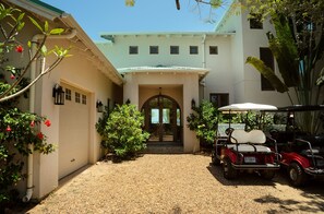 Front entrance: garage(left) and property golf cart(right).