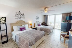 Two Queen Size Beds with a Beach View and Balcony Access