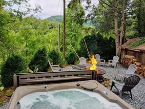 trees and mountain view from hot tub, view changes in seasons