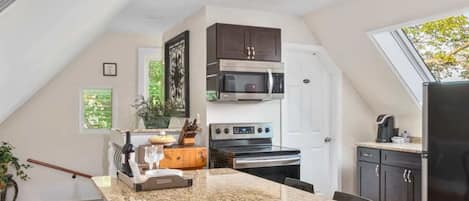 Inviting bar top table for dining or the perfect spot to get some work done.