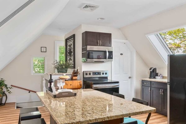 Inviting bar top table for dining or the perfect spot to get some work done.