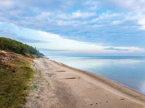Just a half-mile walkdown our tree-lined road brings you to this stunning stretch of sandy Lake Michigan beach. Perfect for morning walks, sunset views, and relaxing by the water. 