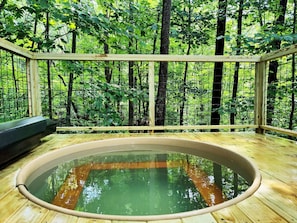 Have a relaxing soak surrounded by nature in our cedar tub!