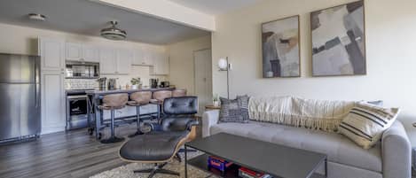 This expansive living space includes WIFI, TV, and a new sofa for kicking back and watching your favorite show or movie.