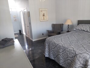 Primary Master bedroom includes dresser and side tables