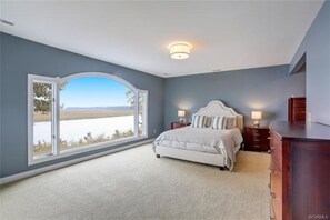 Upstairs master with sweeping river views! Wake up to the glorious sunrises!