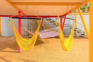 Best seats in the house. Enjoy rope chairs & hammock under the stargazing deck