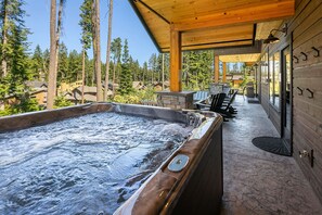 Fit for a King: - Large hot tub under the expansive covered patio.