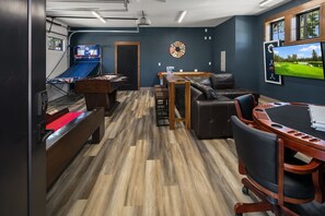 Fit for a King: - Beautifully appointed gaming room in the garage.