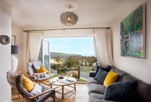 Trewalder, Treyarnon Bay. Ground floor: Snug area within sitting room with bi-folding doors to garden