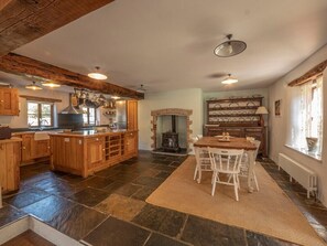 Main House large, fully equipped kitchen and further dining area.