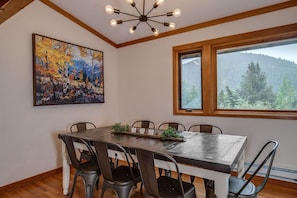 Dining room with farmhouse table and mountain view
