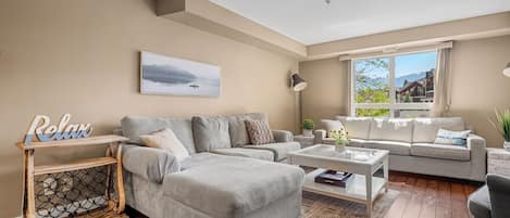 Living room with walkout access to the private balcony.