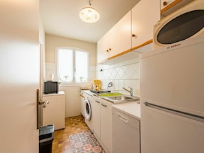 Cabinetry, Light, Building, Window, Lighting, Countertop, Floor, Home Appliance, Kitchen Stove, Kitchen