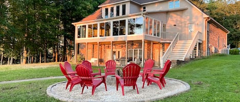 View of the home and fire pit