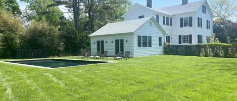 expansive and private back yard with heated gunnite salt water pool