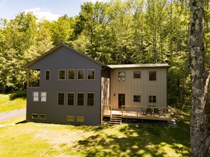 Front of house + deck area.