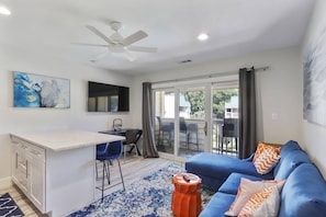 Liiving room with Smart TV for entertainment.
