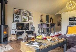 Ground floor: Comfortable sitting area with cosy wood burning stove
