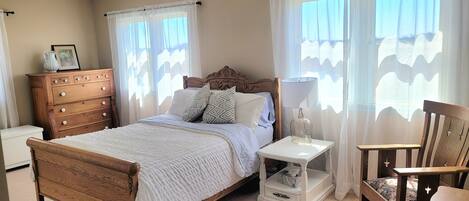 Charming master bedroom with ensuite half bathroom