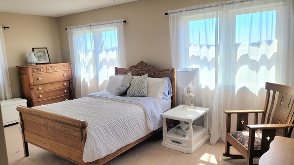 Charming master bedroom with ensuite half bathroom