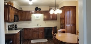 Beautiful, fully stocked kitchen with modern appliances including dishwasher.