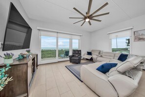 Spacious living room with 85" smart tv