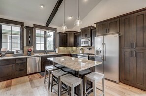 The huge kitchen is fully stocked and equipped for you.