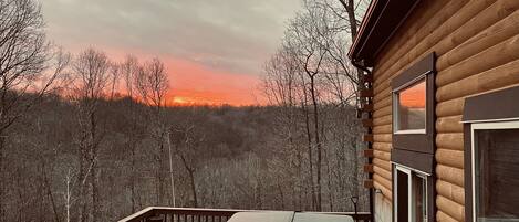 Enjoy your sunset in the hot tub at Wooded Hilltop Escape 