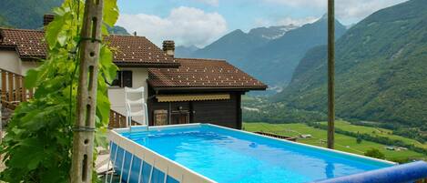 Sky, Cloud, Water, Building, Property, Swimming Pool, Plant, Nature, Azure, Mountain