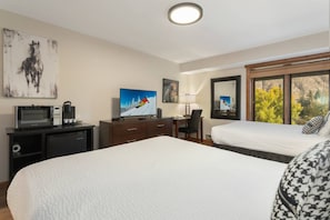 Room Features a Mini Fridge, Microwave, Keurig and Smart TV with Cable.