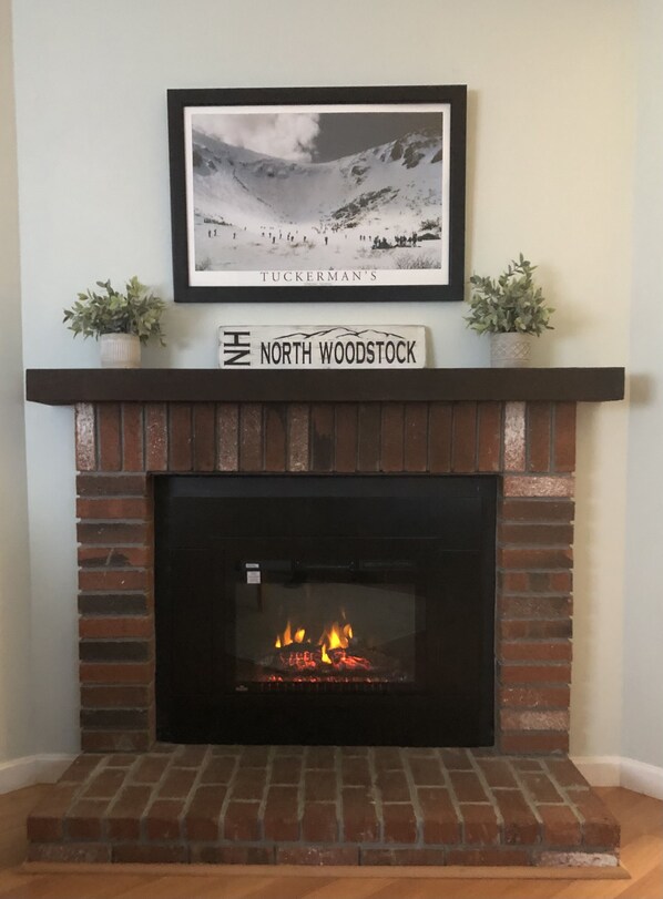 Gas fireplace in the family room and viewable from the dining area.