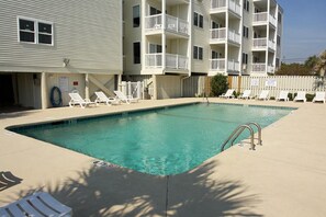 Lounge on the deck while the kids play in the pool.