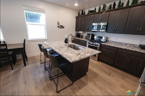 Large Kitchen. Fully stocked with basic cook-ware