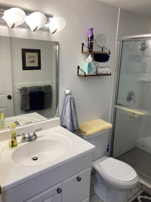 Main floor bathroom across from bedrooms and adjacent to kitchen