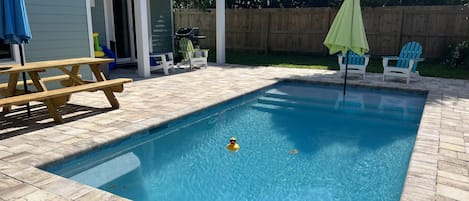 Heated pool 10x20, with large picnic table and umbrella. Gas grill fenced yard. 