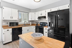The kitchen is roomy and perfect for cooking or baking