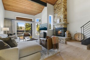 Living Room with Vaulted Wood Ceilings, a  Cozy Sofa and Flat Screen TV, Sliders to Deck