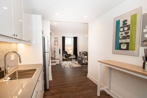 Open, modern kitchen with quartz counters