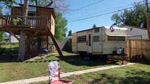 Vintage camper and tree house.