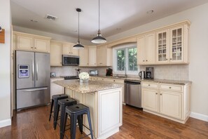 Fully stocked kitchen with Calphalon, T-Fal, Lodge cookware, Henckel knives.