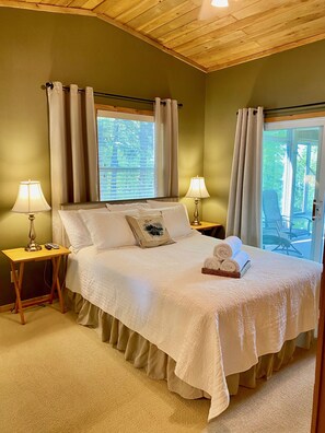 Bedroom 1 - Queen bed and screened in porch with sitting space and hammock 