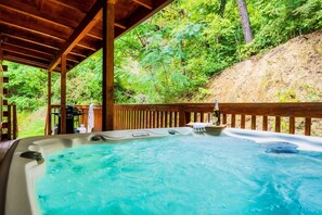 Ample back porch with Hot Tub and Gas grill.