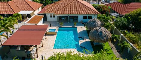 Private pool area with spa and outdoor kitchen