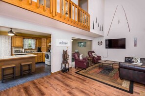 Unwind and create unforgettable memories in the inviting family area of our Poconos getaway. Kick back on the comfortable seating while enjoying the incredible 65-inch smart TV, perfect for family movie nights or catching up on your favorite shows.