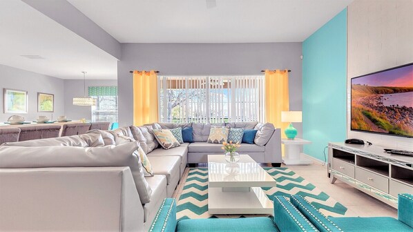 Spacious living room area with cozy sofa, perfect for family reunion